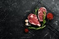 Raw meat, beef steak on dark background. Royalty Free Stock Photo