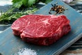 Raw meat beef steak on green rustic table Royalty Free Stock Photo
