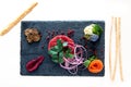 Raw meat carpaccio composition on a slate board