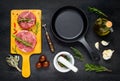 Raw Meat with Frying Pan and Cooking Ingredients Royalty Free Stock Photo