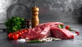 Raw meat on the kitchen table on a metallic background in a composition with cooking Royalty Free Stock Photo