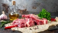 Raw meat on the kitchen table on a metallic background in a composition with cooking Royalty Free Stock Photo