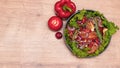 Raw meat. Marbled beef steak in metal baking dish. Vegetables on table. Organic food. Flat lay. Dark Wooden background