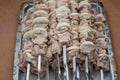 Raw meat and onions are skewered. Pork kebabs are ready to cook.