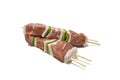 Raw meat and pepper skewers, isolated on a white background. Royalty Free Stock Photo