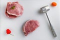 Raw meat, pork steaks on kitchen table. Royalty Free Stock Photo