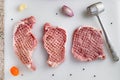 Raw meat, pork steaks on kitchen  table. Royalty Free Stock Photo