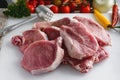 Raw meat, pork steaks on kitchen table. Royalty Free Stock Photo