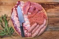 Raw meat products.Barbecue pork ribs, steaks, grilled sausages,minced meat, garnished with spices on a round wooden Royalty Free Stock Photo