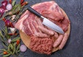 Raw meat products.Barbecue pork ribs, steaks, grilled sausages,minced meat, garnished with spices on a round wooden chopping board Royalty Free Stock Photo