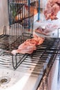 Raw meat put on some grills to cook on the barbecue Royalty Free Stock Photo