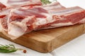 Raw meat ribs on wooden board on white background Royalty Free Stock Photo