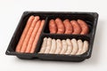 Raw meat sausages in the container Royalty Free Stock Photo