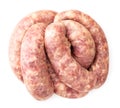 Raw meat sausages on a white isolated background. The view from top Royalty Free Stock Photo