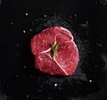 Raw meat steak Tenderloin fillet, on black stone plate Royalty Free Stock Photo