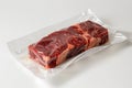 Raw meat in vacuum packaging on a white table Royalty Free Stock Photo
