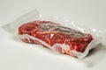 Raw meat in vacuum packaging on a white table Royalty Free Stock Photo