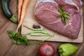 Raw meat and vegetables on a cutting board Royalty Free Stock Photo