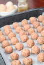 Raw meatballs on baking sheet Royalty Free Stock Photo