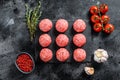 Raw meatballs made from ground beef. Black background. Top view