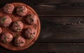 Raw meatballs, with micro greenery, on a cutting board, homemade, rustic, no people,