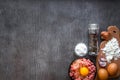 Raw minced meat with egg yolk, wooden cutting board on wooden background