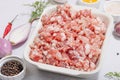 Raw minced meat, spices and herbs. Traditional ingredients for cooking cutlets or meatballs Royalty Free Stock Photo