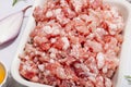 Raw minced meat, spices and herbs. Traditional ingredients for cooking cutlets or meatballs Royalty Free Stock Photo