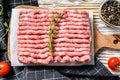 Raw minced pork on a chopping Board. Organic ground meat, forcemeat. White background. Top view