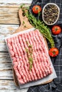 Raw minced pork on a chopping Board. Organic ground meat, forcemeat. White background. Top view