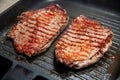 Raw minute steak of marbled beef in a grill pan Royalty Free Stock Photo