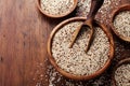 Raw mixed quinoa in bowl on wooden kitchen table top view. Healthy and diet superfood product