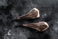 Raw monkfish without a head. Black background. Top view Royalty Free Stock Photo