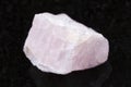 raw morganite (pink beryl) crystal on dark Royalty Free Stock Photo