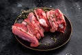 Raw mutton cut rib chops, fresh lamb meat with herbs for grilling. black background. top view Royalty Free Stock Photo