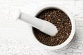 Raw, natural, unprocessed black pepper peppercorns in mortar Royalty Free Stock Photo
