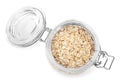 Raw oatmeal in glass jar isolated on white, top view Royalty Free Stock Photo