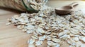 Raw oatmeal is scattered on the desk Royalty Free Stock Photo