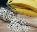 Raw oatmeal is scattered on the desk Royalty Free Stock Photo