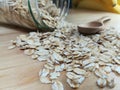 Raw oatmeal is scattered on the desk Royalty Free Stock Photo