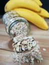 Raw oatmeal is scattered on the desk Royalty Free Stock Photo