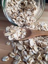 Raw oatmeal is scattered on the desk Royalty Free Stock Photo