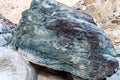 Raw ore of copper, green stones and rocks containing copper in old mining area, Hajar Mountains, United Arab Emirates