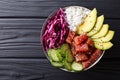 Raw Organic Ahi Tuna Poke Bowl with Rice and Veggies close-up. H Royalty Free Stock Photo