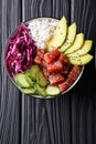 Raw Organic Ahi Tuna Poke Bowl with Rice and Veggies close-up. V