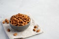 Raw Organic Almonds in a Bowl on a gray background, side view. Copy space Royalty Free Stock Photo