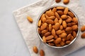 Raw Organic Almonds in a Bowl on a gray background, top view Royalty Free Stock Photo