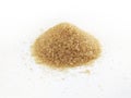Raw Organic Cane Sugar in bulk isolated on white background. Whole brown sweetener. Top view. Food ingredients concept Royalty Free Stock Photo