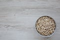 Raw Organic Dry White Beans in a Gray Bowl, top view. Flat lay, overhead, from above. Space for text Royalty Free Stock Photo