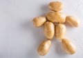 Raw organic potatoes on a white background